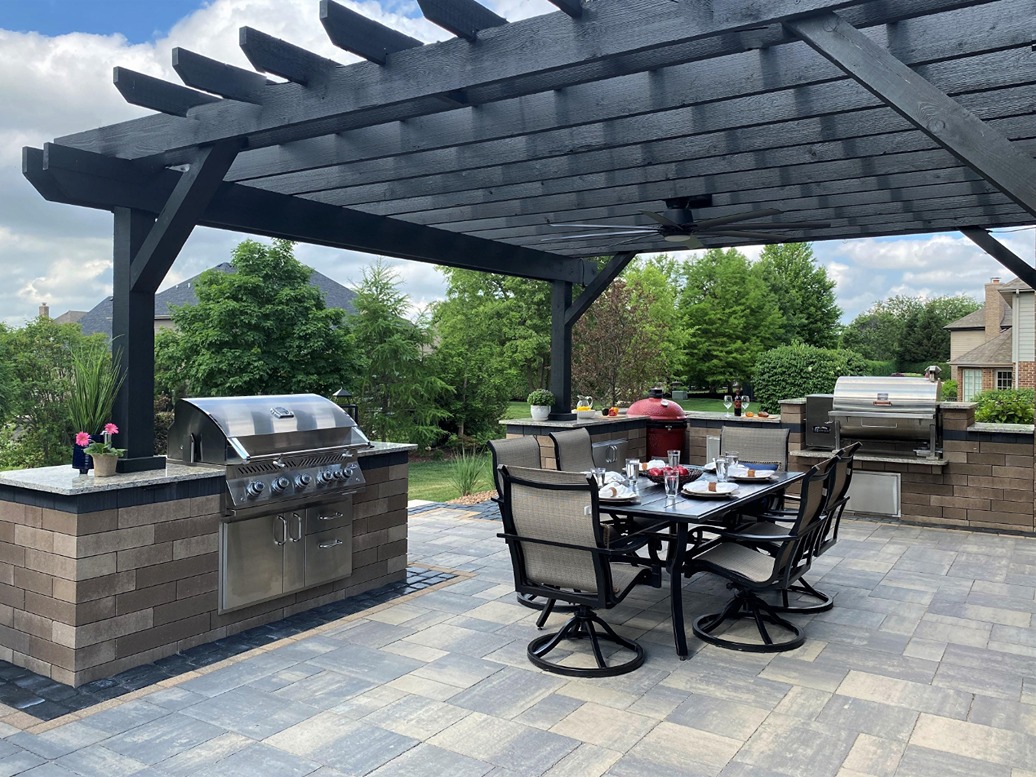 Image of a Frankfort patio with double gas grills and seating area for dining.