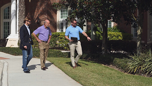 Hartman’s Account Managers inspect a property with a client, receiving feedback while offering advice and suggestions.